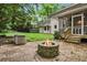 Charming backyard with a brick patio and fire pit, perfect for entertaining guests at 2771 Kenwood Dr, Duluth, GA 30096