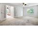 Bright bedroom with French doors, carpet, and natural light shining through a large window at 2771 Kenwood Dr, Duluth, GA 30096