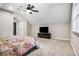 Spacious carpeted bedroom features a ceiling fan, natural light, and neutral walls at 2771 Kenwood Dr, Duluth, GA 30096