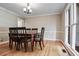 Dining room with hardwood floors, chandelier, and large windows for natural light at 2771 Kenwood Dr, Duluth, GA 30096