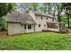 Two-story home exterior with bay window, screened porch, and a spacious backyard at 2771 Kenwood Dr, Duluth, GA 30096