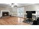 Living room featuring a fireplace, hardwood floors, and French doors at 2771 Kenwood Dr, Duluth, GA 30096