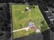 Aerial shot of the entire property, including a pool and multiple outbuildings at 3905 Pointer Rd, Loganville, GA 30052