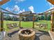 Inviting backyard with a charming fire pit and swing set, perfect for outdoor entertaining at 3905 Pointer Rd, Loganville, GA 30052