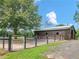 Spacious barn and fenced area, ideal for livestock and agricultural pursuits at 3905 Pointer Rd, Loganville, GA 30052