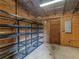 Barn storage area with heavy duty shelving on a concrete slab floor with access door and electrical panel at 3905 Pointer Rd, Loganville, GA 30052