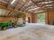 Spacious barn featuring stalls, open entry and fluorescent lighting at 3905 Pointer Rd, Loganville, GA 30052