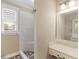 Bathroom featuring a shower with stone floors and tiled walls at 3905 Pointer Rd, Loganville, GA 30052