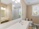 Contemporary bathroom with a large mirror, dual sink vanity, and shower at 3905 Pointer Rd, Loganville, GA 30052