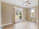 Well-lit bedroom with hardwood floors and two large windows at 3905 Pointer Rd, Loganville, GA 30052