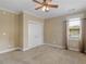 Cozy bedroom with a ceiling fan, a window and neutral carpeting at 3905 Pointer Rd, Loganville, GA 30052
