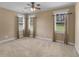 Bright bedroom with three windows offering serene views of the surrounding landscape at 3905 Pointer Rd, Loganville, GA 30052