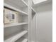 Walk-in closet features built-in shelving and a personal safe at 3905 Pointer Rd, Loganville, GA 30052