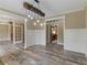 Open concept dining area with view to foyer and kitchen at 3905 Pointer Rd, Loganville, GA 30052