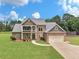 Stunning two-story home with a well-manicured lawn and attached two car garage at 3905 Pointer Rd, Loganville, GA 30052