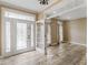 Bright foyer with decorative glass front door and wood-look tile floor at 3905 Pointer Rd, Loganville, GA 30052