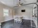 Bright interior featuring a dining table, ceiling fan, and exposed beams, perfect for versatile use at 3905 Pointer Rd, Loganville, GA 30052
