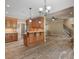 Kitchen with wood cabinets, pendant lights, and breakfast bar at 3905 Pointer Rd, Loganville, GA 30052
