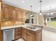 Kitchen with wood cabinets, stainless steel appliances, and breakfast bar at 3905 Pointer Rd, Loganville, GA 30052