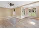 Open living room boasts wood-look floors, neutral walls and large windows for plenty of light at 3905 Pointer Rd, Loganville, GA 30052