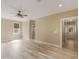 Spacious main bedroom with wood-look floors, neutral walls and ceiling fan at 3905 Pointer Rd, Loganville, GA 30052