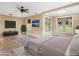 Spacious main bedroom with wood-look floors and lots of natural light at 3905 Pointer Rd, Loganville, GA 30052
