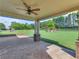 Covered patio with columns overlooking the expansive backyard at 3905 Pointer Rd, Loganville, GA 30052