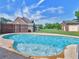 Backyard oasis featuring a sparkling pool and lush landscaping at 3905 Pointer Rd, Loganville, GA 30052