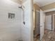 Stylish shower with stone accents, tiled walls, and modern fixtures at 3905 Pointer Rd, Loganville, GA 30052