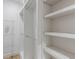 Large walk-in closet has multiple shelves and hanging racks for maximum storage at 3905 Pointer Rd, Loganville, GA 30052