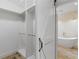 Spacious walk-in closet leads to bathroom with free standing tub at 3905 Pointer Rd, Loganville, GA 30052