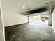Spacious two-car garage with a concrete floor and an automatic door at 500 Healy Dr # 77, Cumming, GA 30040