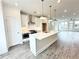 Bright kitchen with island, stainless steel appliances, and eat-in dining space at 500 Healy Dr # 77, Cumming, GA 30040