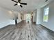Spacious open-concept living area with modern flooring at 500 Healy Dr # 77, Cumming, GA 30040