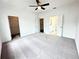Spacious main bedroom with carpeted floors and ensuite bathroom at 500 Healy Dr # 77, Cumming, GA 30040
