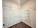 Walk-in closet with carpet and multiple wire shelving units, perfect for storage at 500 Healy Dr # 77, Cumming, GA 30040