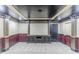 Finished basement with custom millwork and large blank wall ready for a big screen at 6118 Arbor Links Rd, Lithonia, GA 30058