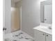 Modern bathroom featuring a vanity sink, toilet, and shower with glass door at 6118 Arbor Links Rd, Lithonia, GA 30058