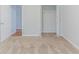 Carpeted bedroom with closet and access to the rest of the house at 6118 Arbor Links Rd, Lithonia, GA 30058