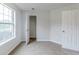 Cozy bedroom with neutral carpet and ample natural light with a closet and doorways at 6118 Arbor Links Rd, Lithonia, GA 30058