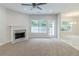 Spacious living room with fireplace, lots of light and access to the outdoors at 6118 Arbor Links Rd, Lithonia, GA 30058