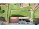 Aerial view of a well-maintained backyard, fully fenced in with a playground at 1560 Heritage Trl, Roswell, GA 30075