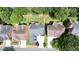 Neighborhood aerial view showcasing well-manicured lawns, mature trees, and upscale homes at 1560 Heritage Trl, Roswell, GA 30075
