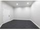 This is a bonus room with black floor tiles, white walls, and one door at 1560 Heritage Trl, Roswell, GA 30075