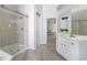 Clean bathroom featuring a glass shower, vanity, and updated fixtures at 1560 Heritage Trl, Roswell, GA 30075