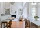 Open-concept living room showcasing hardwood floors, fireplace, built-ins, and natural light at 1560 Heritage Trl, Roswell, GA 30075