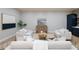 An open living room features stylish decor, a wet bar, and plenty of natural light at 1560 Heritage Trl, Roswell, GA 30075