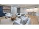The open-concept living area features wood flooring, a wet bar, and plenty of space to relax at 1560 Heritage Trl, Roswell, GA 30075