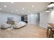 The large living room boasts ample seating, recessed lighting, and a stylish bar area at 1560 Heritage Trl, Roswell, GA 30075