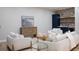 Relax in the living room with comfortable seating and a convenient wet bar for entertaining at 1560 Heritage Trl, Roswell, GA 30075